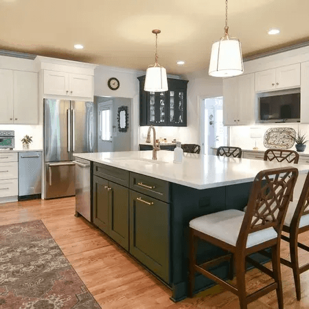 Bright contemporary kitchen with natural wood lower drawers and sleek white upper cabinets.